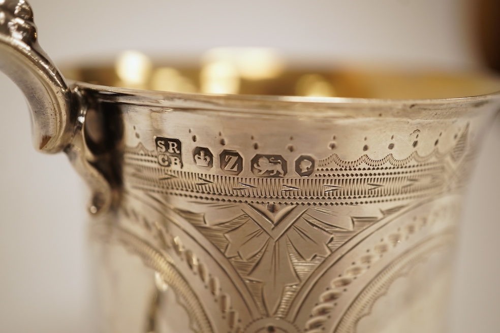 A Victorian bright cut engraved silver christening mug, of waisted form, with engraved inscription and beaded handle, Samuel Roberts & Charles Belk, Sheffield, 1867, 82mm, 5.2oz.